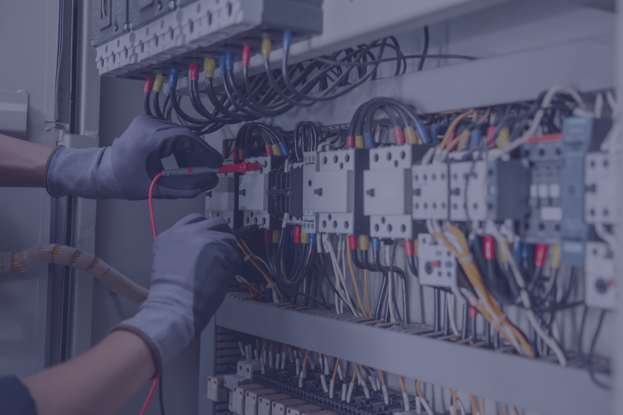 Electrician tests industrial electrical circuits